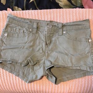 green levi shorts
